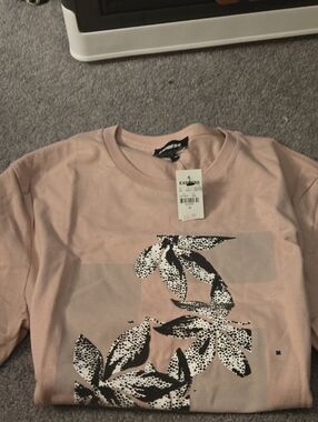 Express Light Pink Tee with Black & White Leaf Graphic